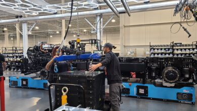 Nikola worker maneuvers a battery pack at Nikola's plant in Coolidge, Arizona