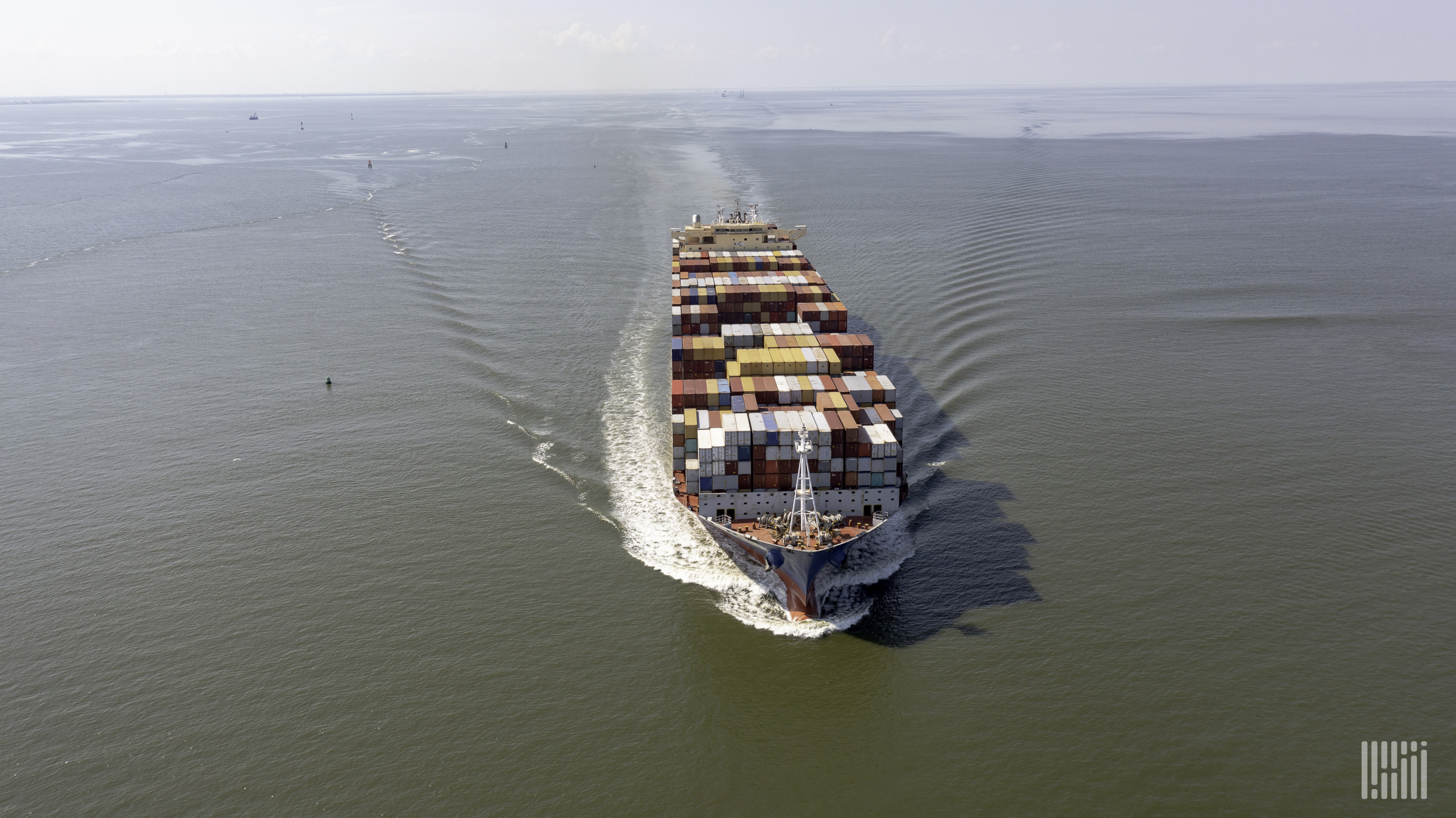 An ocean vessel is transporting thousands of shipping containers.