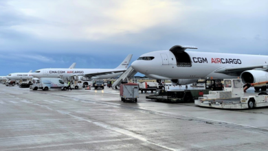 White CMA CGM Air Cargo planes side by side on the tarmac.